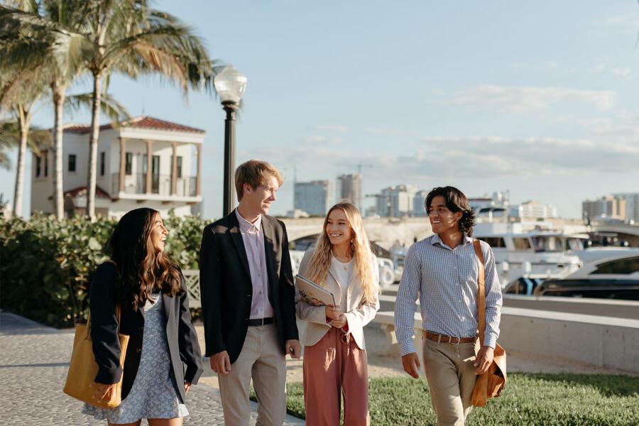 master of business administration mba students walk near the intercoastal waterway in 西<a href='http://h4.lightscribecovers.com'>推荐全球最大网赌正规平台欢迎您</a>.